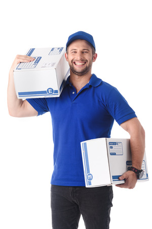 Happy delivery man laugh while carry parcel boxes, online delivery conceptualの写真素材