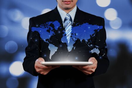 businessman holding tablet  show globalization conceptualの写真素材