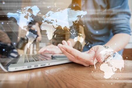 Globalization conceptual of technology use laptop and smartphone, wireless internet connection every whereの写真素材