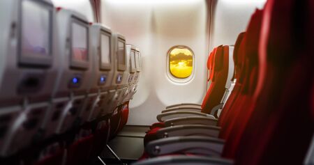 Empty passenger seat in an airplane in redの写真素材