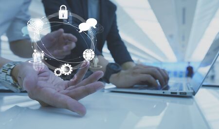 Businessman working with icon of AI, security, human resource, globalization and network technologyの写真素材