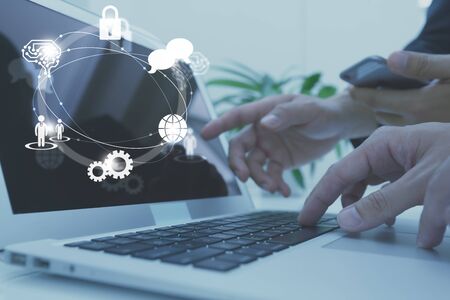 Businessman working with icon of AI, security, human resource, globalization and network technologyの写真素材