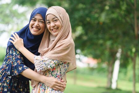Portrait of two close friend islamic girl or sister hug each otherの写真素材