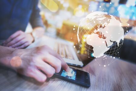 Globalization conceptual of technology use laptop and smartphone, wireless internet connection everywhereの写真素材
