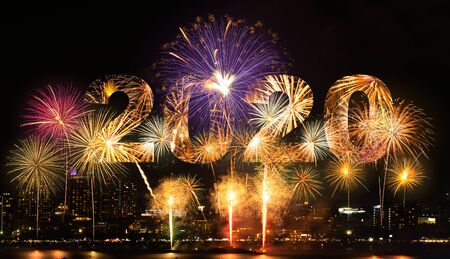 New year celebration fireworks with city in background of year 2020の写真素材