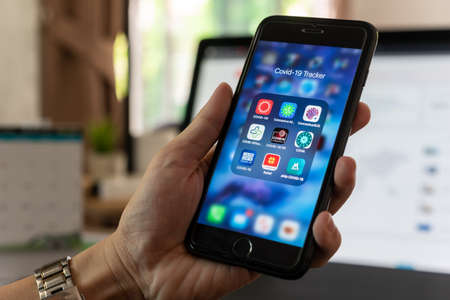 NONTABURI, THAILAND - May 21st, 2020 : Hands of man show screen of iphone with application of...