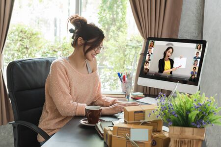 Online course attended by woman at home, learning at home with 10 other peopleの写真素材