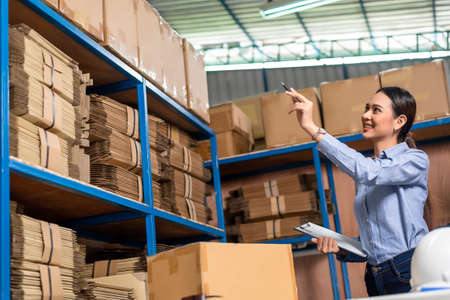 Warehouse worker doing stock checkingの写真素材