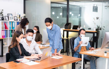 Six asian people work in office with face mask on everyone, new normal life styleの写真素材