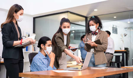 Six asian people work in office with face mask on everyone, new normal life styleの写真素材