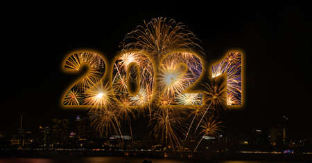 New year celebration fireworks with city in background of year 2021の写真素材
