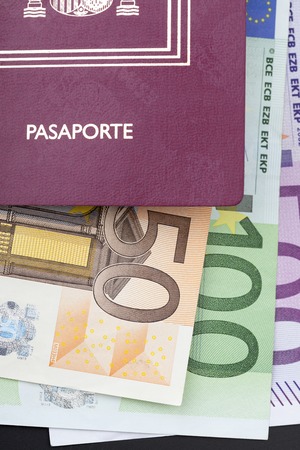 Spanish passport with money, 50 100 and 500 euros billsの写真素材