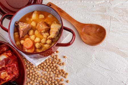Homemade chickpea stew Madrid stew of chickpeas, meat and vegetables (chorizo, blood sausage, ham, garlic, onion, carrot, veal, chicken). Typical Spanish dishの写真素材