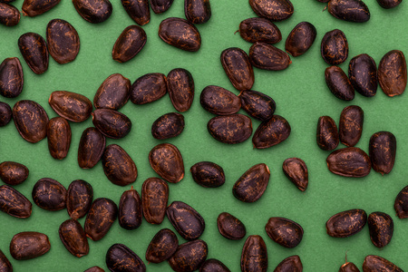 Chirimoya nuggets (seeds). Texture on green background