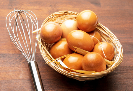 Fresh eggs and rods to beat them (manual beater). Beat eggs for pastries and tortillas. Close-up...