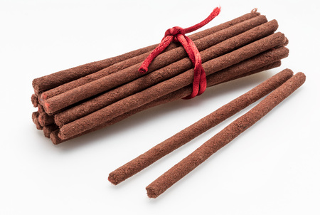 Tibetan incense sticks (red sandalwood). Isolated on white background.の写真素材