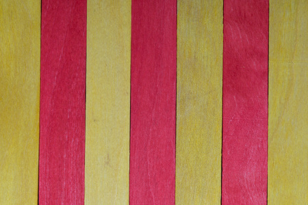 Beautiful texture of natural wood slats of red and yellow colors. Flag of Catalonia. Natural and aged appearance.の写真素材