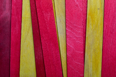 Beautiful texture of natural wood slats of red and yellow colors. Flag of Catalonia. Natural and aged appearance.の写真素材