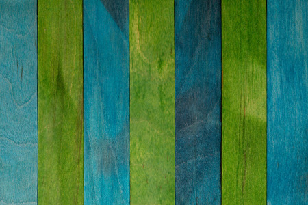 Beautiful texture of natural wood slats of blue (turquoise) and green colors. Natural and aged appearance.の写真素材
