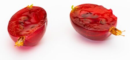 Delicious thorny red gooseberries (Ribes hirtellum - Rode Gooseberry) open (split in half). Isolated on white background.の写真素材