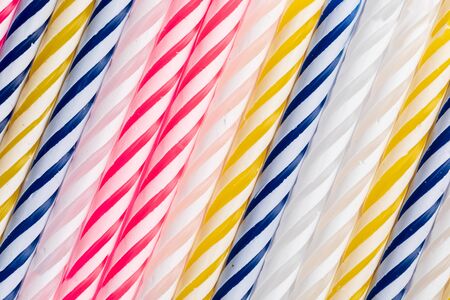 Texture with birthday candles. Diagonal position Very colorful, with blue, red, yellow and white....