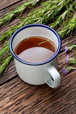 Infusion of rosemary (Rosmarinus officinalis). Ingredient of Mediterranean cuisine and healing home remedy. Rustic appearance.の写真素材