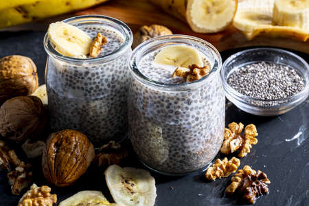 Appetizing, healthy and refreshing chia seed pudding with fresh blueberries and mint leaves. Vegetarian and vegan food with healthy superfoods. Homemade look.の写真素材