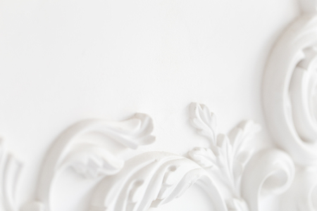 Beautiful ornate white decorative plaster moldings in studioの写真素材
