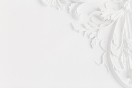 Beautiful ornate white decorative plaster moldings in studioの写真素材