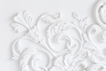 Beautiful ornate white decorative plaster moldings in studioの写真素材