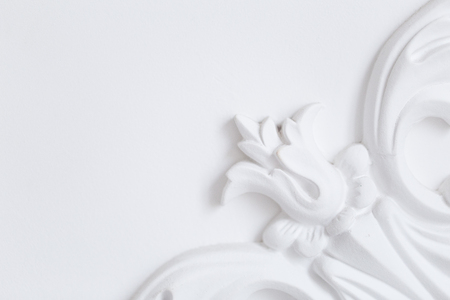 Beautiful ornate white decorative plaster moldings in studioの写真素材