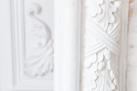 Beautiful ornate white decorative plaster moldings in studioの写真素材