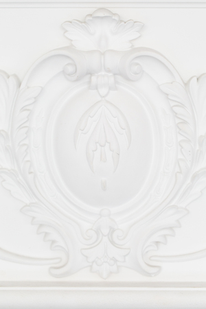 Beautiful ornate white decorative plaster moldings in studioの写真素材