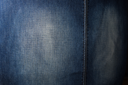 Denim chair. Modern armchair over rustic wall in Living room interior redecoration renovation conceptualの写真素材