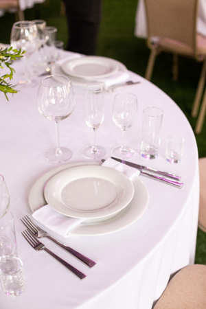 Table setting in the restaurant. Preparing for the Banquet Selective focus.の写真素材