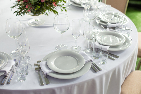 Table setting in the restaurant. Preparing for the Banquet Selective focus.の写真素材