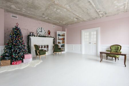 Classic Christmas interior living room with Christmas tree and fireplace.の写真素材