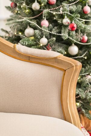 Vintage sofa in the interior with Christmas tree. Close up. Selective focus.