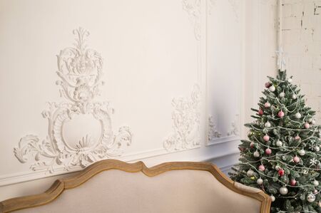 Vintage sofa in the interior with Christmas tree. Close up. Selective focus.の写真素材