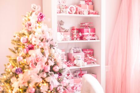 Childrens wardrobe with lots of toys and christmas tree. Selective focus.の写真素材