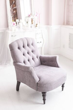 Gray vintage chair in the luxurious interior of the living room. Soft focus.の写真素材