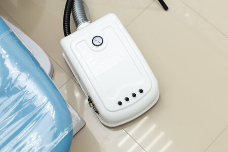 Special equipment placed on the floor near dentist chairの写真素材