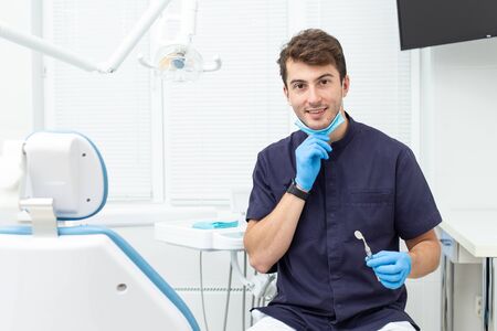 Dental polymerization lamp with UV light and laser. Stomatological instrument in the dentist clinic. Medicine, health, stomatology concept.の写真素材