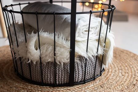 White and gray plaids lay under the table. Cozy atmosphereの写真素材