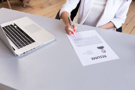 Closeup of resume laying on the office table in front of HRの写真素材