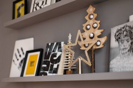 Nizhniy Novgorod, Russia - November 11, 2019: Photo studio 2.8. A close-up of the contents of a shelf decorated for Christmas. Selective focusのeditorial素材