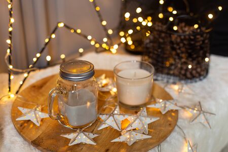 Closeup of jar of milk and mug siting on a tray with stars. Holiday atmosphereの写真素材