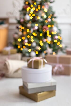Closeup of groups of gift boxes with christmas tree on background. Selective focusの写真素材