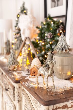 Lots of Christmas decorations standing on wooden desk. Selective focusの写真素材
