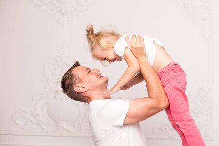 Father and his daughter playing together at fathers dayの写真素材